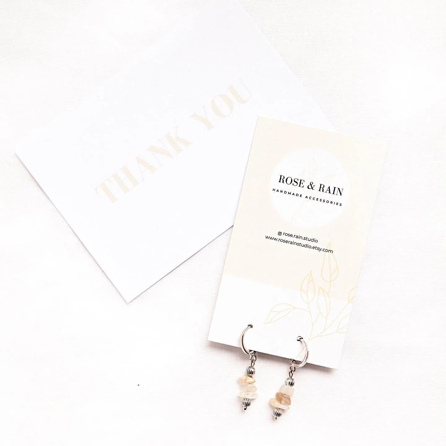 CLIP ON LILY MOONSTONE HUGGIE EARRINGS IN PLATINUM