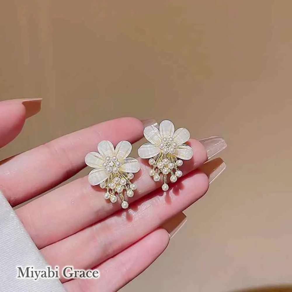 Large White Flower Coil Clip On Earrings