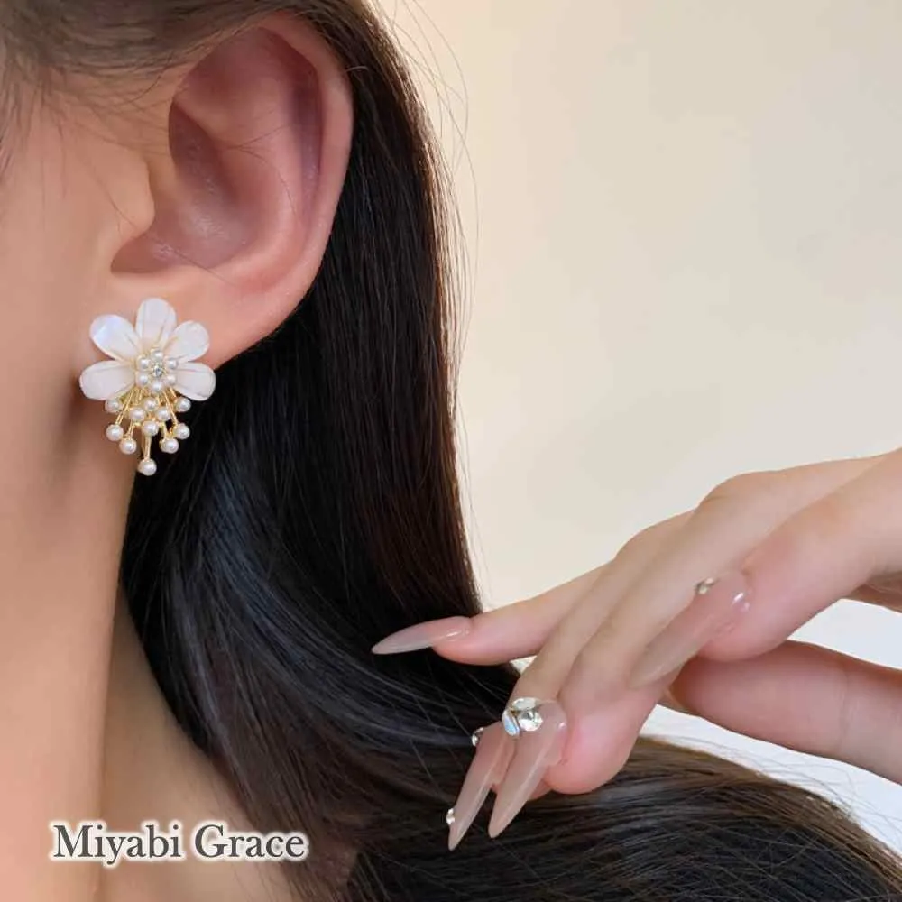 Large White Flower Coil Clip On Earrings